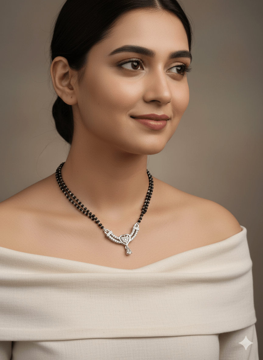 Woman wearing a necklace with a detailed pendant against a neutral background