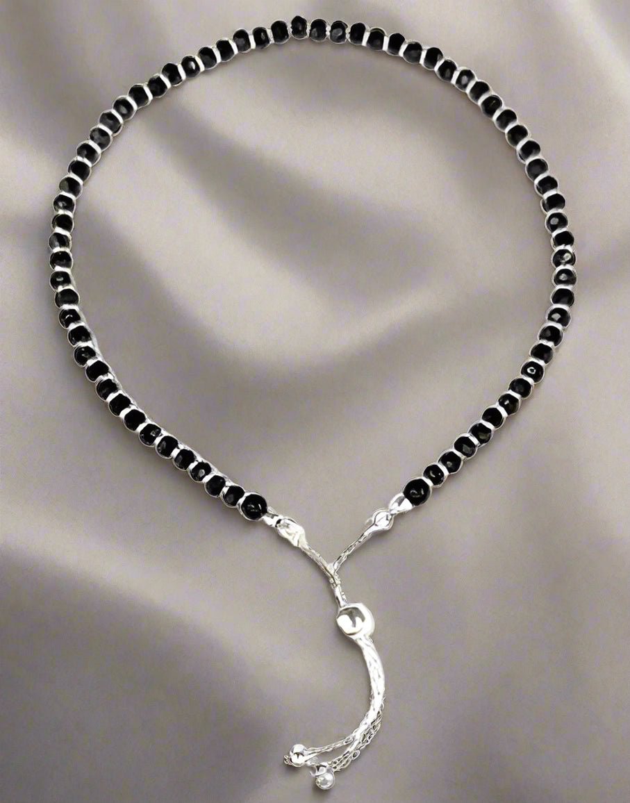 925 Sterling Silver Nazariya Anklet with a beautiful combination of black and silver beads, designed for girls and women. This adjustable anklet is perfect for adding a stylish, meaningful touch to any outfit, offering comfort and durability. A perfect accessory for daily wear, cultural rituals, or special occasions, this anklet symbolizes protection and good fortune. Crafted with high-quality sterling silver, itƒ??s a versatile piece that fits all sizes, making it an ideal gift for your loved ones. A must-