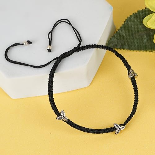 A beautifully handcrafted 925 sterling silver black thread anklet featuring three intricately designed flower-shaped beads. This stylish anklet combines traditional and modern elements, with an adjustable black thread for a comfortable fit, perfect for women and girls. Made from pure silver, it adds a touch of elegance and charm to any outfit, ideal for daily wear or special occasions.