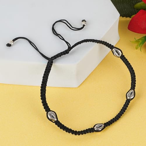 A beautifully handcrafted 925 sterling silver anklet featuring four intricate Sankh beads, strung on an adjustable black thread. This stylish anklet is perfect for women and girls, blending traditional charm with a modern twist. The black thread provides both comfort and durability, making it ideal for daily wear or special occasions. The Sankh beads add a touch of elegance and spirituality, symbolizing purity and prosperity.