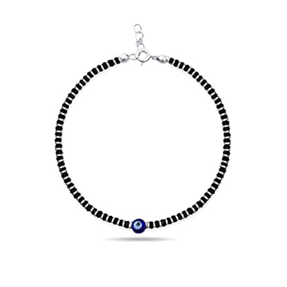 A beautiful 925 sterling silver black thread anklet featuring a protective evil eye charm, accented with a combination of black and silver beads. This stylish and adjustable anklet is perfect for girls and women, offering both comfort and elegance. Ideal for daily wear or special occasions, the anklet combines the timeless appeal of sterling silver with the fashionable touch of black thread and beads, making it a perfect accessory for any outfit.