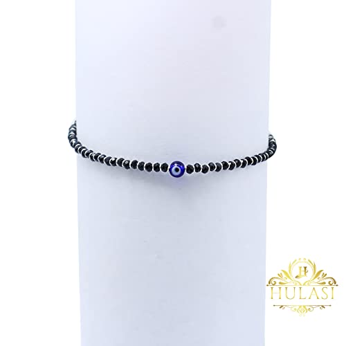 A beautiful 925 sterling silver black thread anklet featuring a protective evil eye charm, accented with a combination of black and silver beads. This stylish and adjustable anklet is perfect for girls and women, offering both comfort and elegance. Ideal for daily wear or special occasions, the anklet combines the timeless appeal of sterling silver with the fashionable touch of black thread and beads, making it a perfect accessory for any outfit.