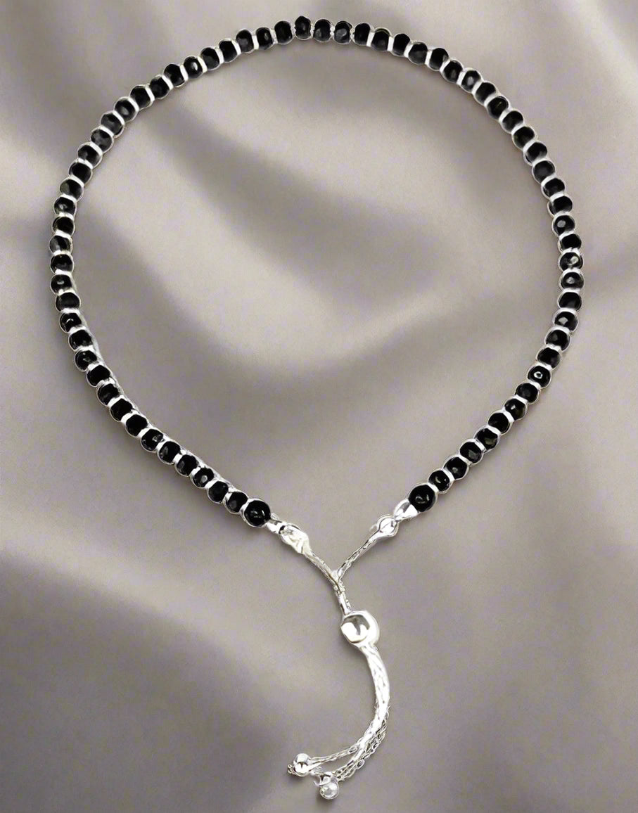 925 Sterling Silver Nazariya Anklet with a beautiful combination of black and silver beads, designed for girls and women. This adjustable anklet is perfect for adding a stylish, meaningful touch to any outfit, offering comfort and durability. A perfect accessory for daily wear, cultural rituals, or special occasions, this anklet symbolizes protection and good fortune. Crafted with high-quality sterling silver, it’s a versatile piece that fits all sizes, making it an ideal gift for your loved ones. A must-ha