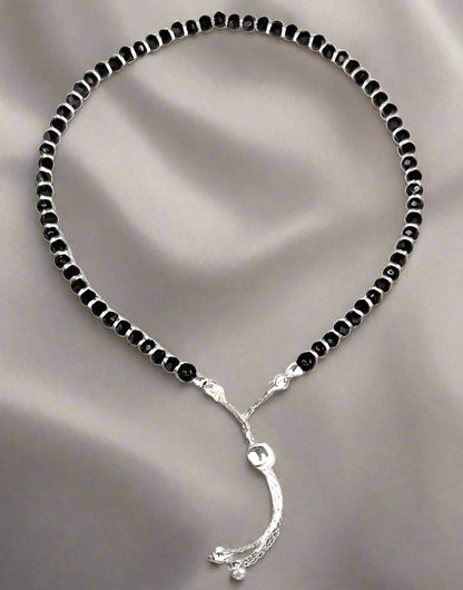 925 Sterling Silver Nazariya Anklet with a beautiful combination of black and silver beads, designed for girls and women. This adjustable anklet is perfect for adding a stylish, meaningful touch to any outfit, offering comfort and durability. A perfect accessory for daily wear, cultural rituals, or special occasions, this anklet symbolizes protection and good fortune. Crafted with high-quality sterling silver, it’s a versatile piece that fits all sizes, making it an ideal gift for your loved ones. A must-ha
