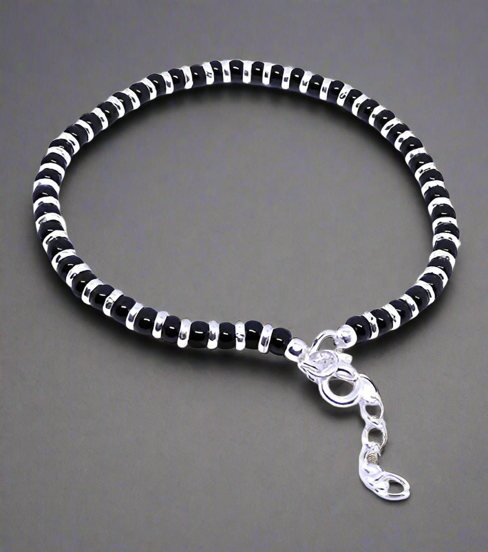 Nazariya bracelet for women crafted from 92.5% pure sterling silver, featuring black crystals. This elegant bracelet is 7 inches long with an extension for a perfect fit, designed to bring style and comfort. A beautiful and meaningful accessory, ideal for those seeking a unique and fashionable piece of jewelry with a protective charm.