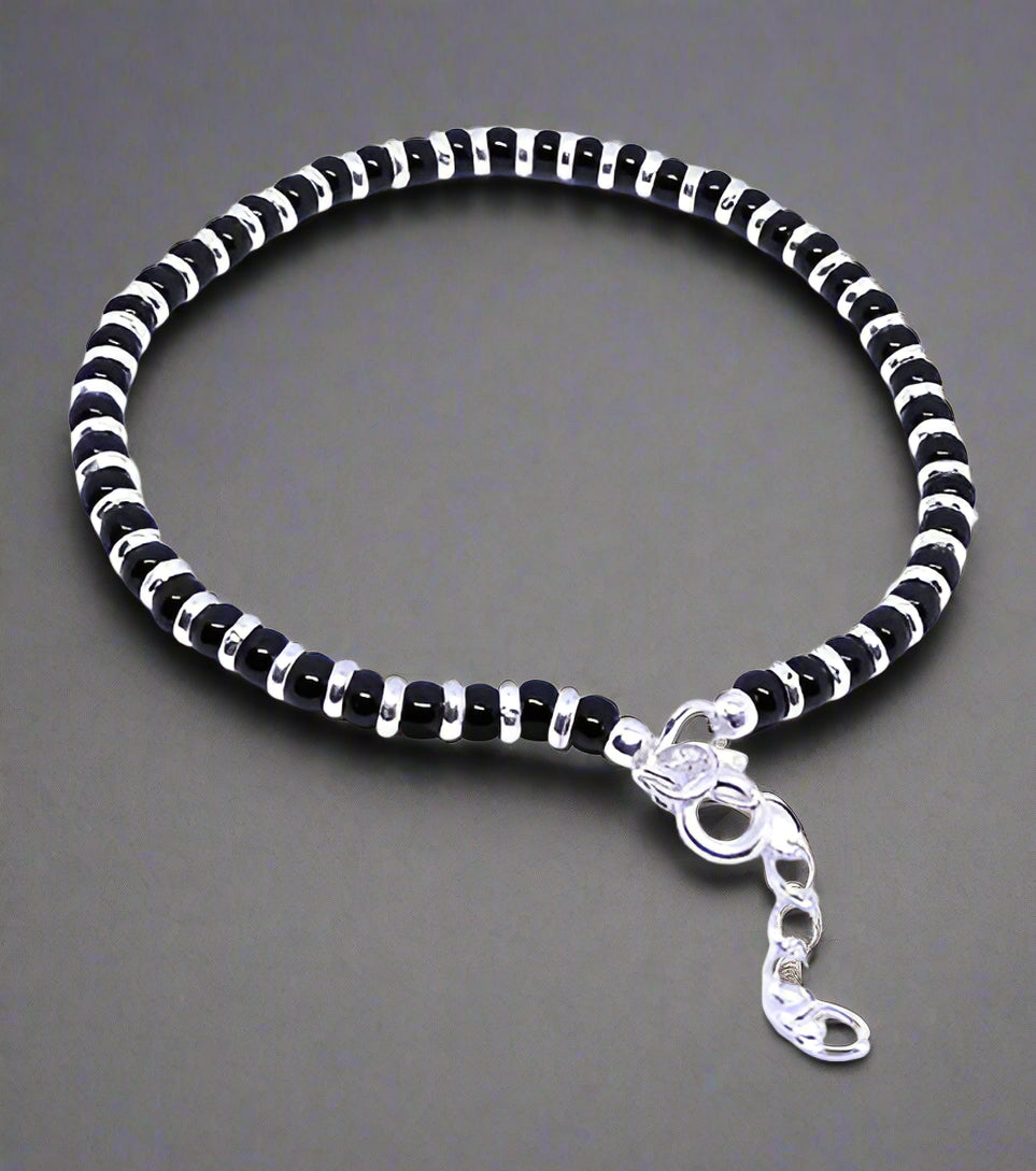 Nazariya bracelet for women crafted from 92.5% pure sterling silver, featuring black crystals. This elegant bracelet is 7 inches long with an extension for a perfect fit, designed to bring style and comfort. A beautiful and meaningful accessory, ideal for those seeking a unique and fashionable piece of jewelry with a protective charm.