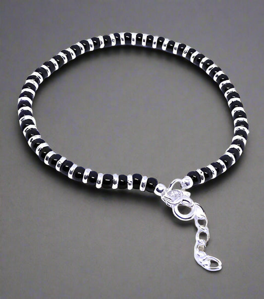 Nazariya bracelet for women crafted from 92.5% pure sterling silver, featuring black crystals. This elegant bracelet is 7 inches long with an extension for a perfect fit, designed to bring style and comfort. A beautiful and meaningful accessory, ideal for those seeking a unique and fashionable piece of jewelry with a protective charm.
